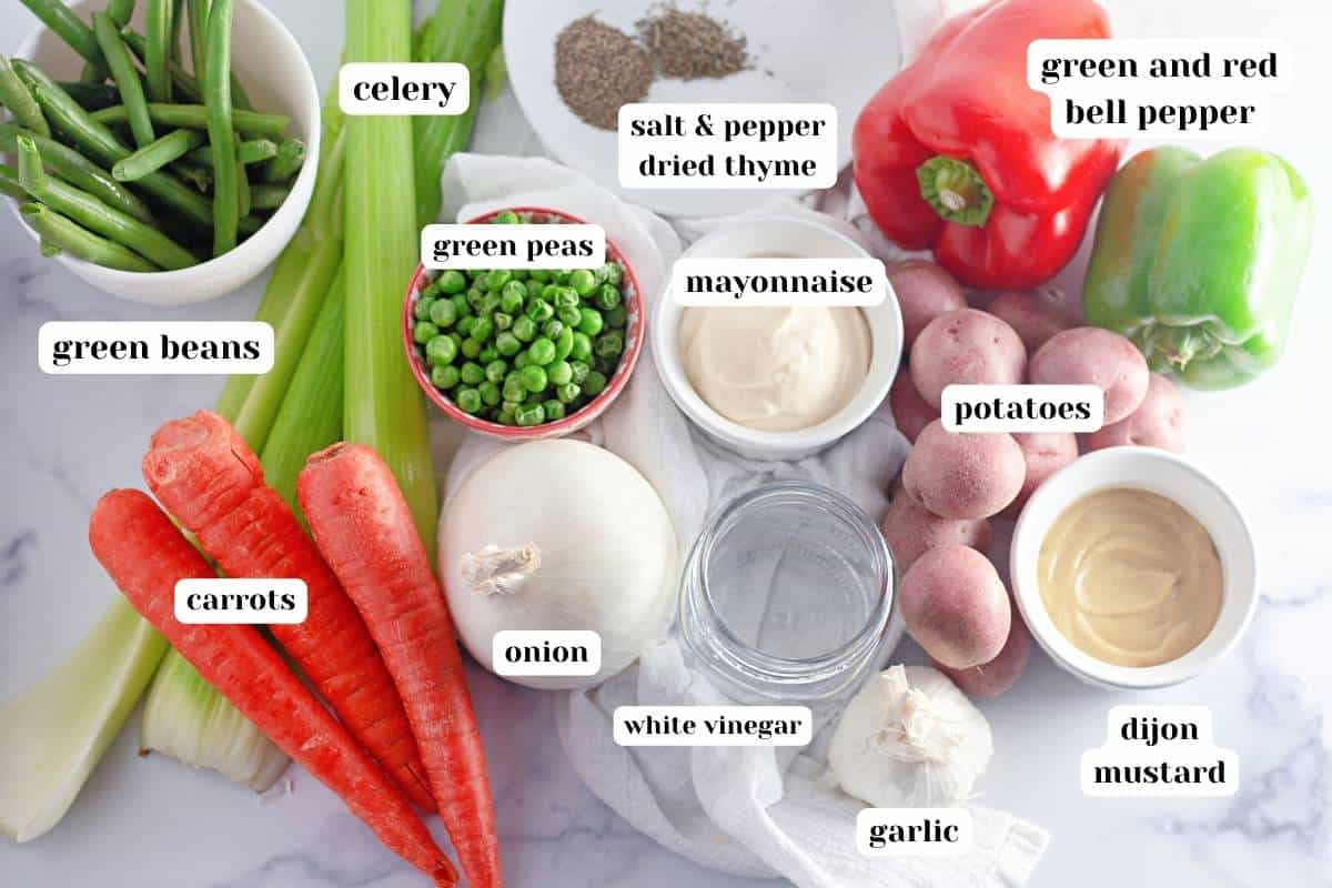 Ingredients to make Ensalada Rusa Guatemalteca on the table.