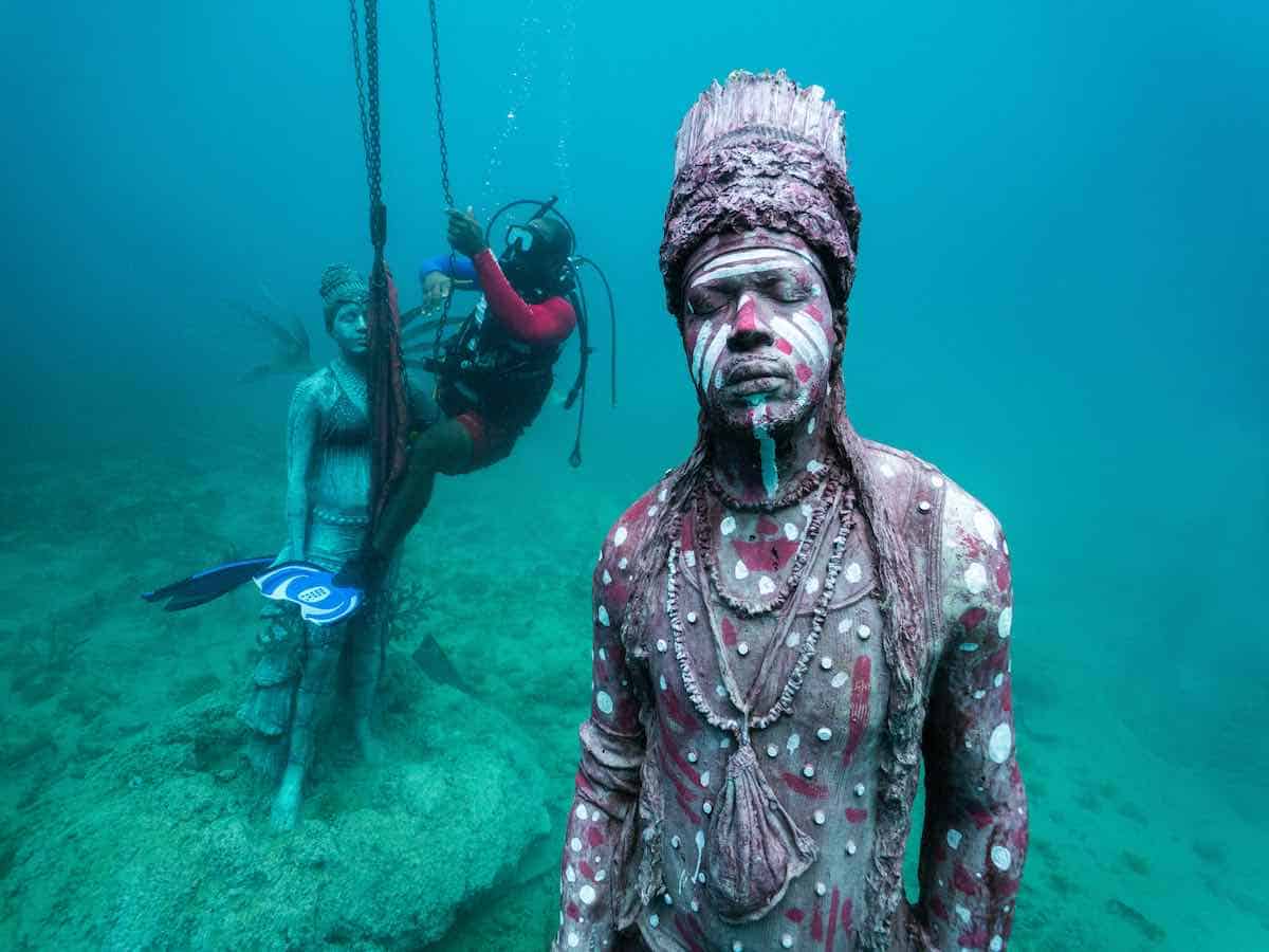 Scuba diver installing a new sculpture at the Grenada Underwater Sculpture Park.