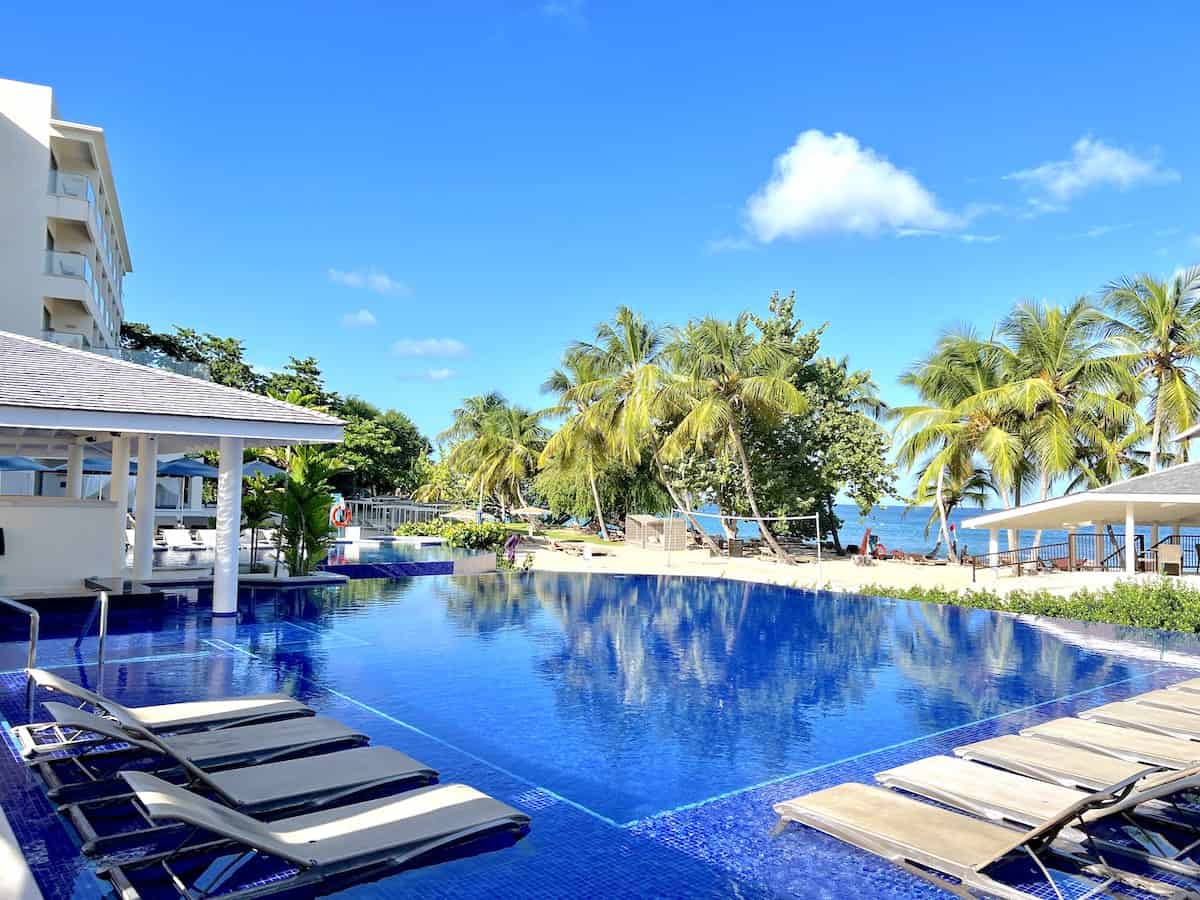 Oceanfront swimming pools at the Royalton Grenada with Diamond Club Beach in the background.