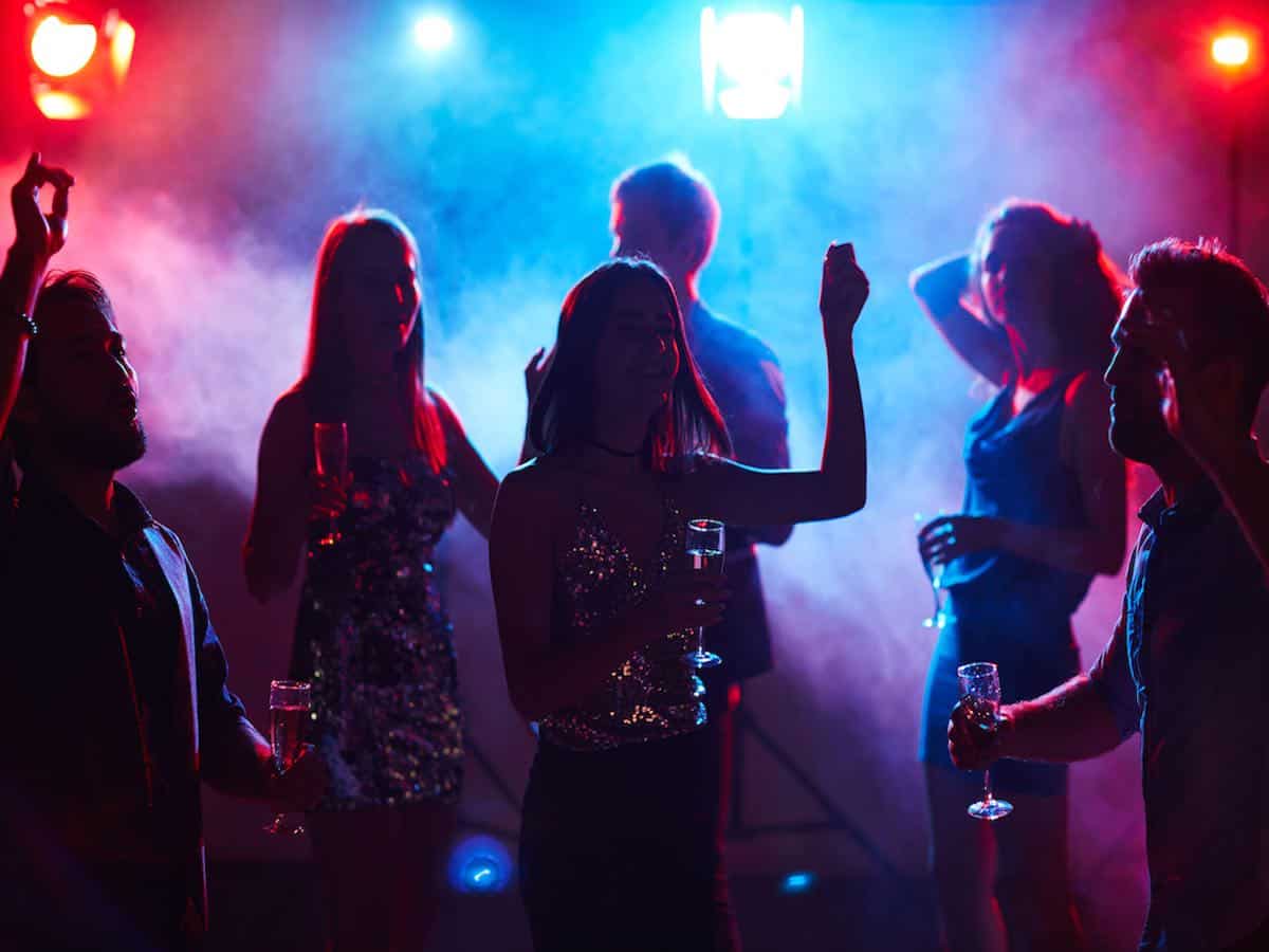 Young people dancing at a nightclub. 