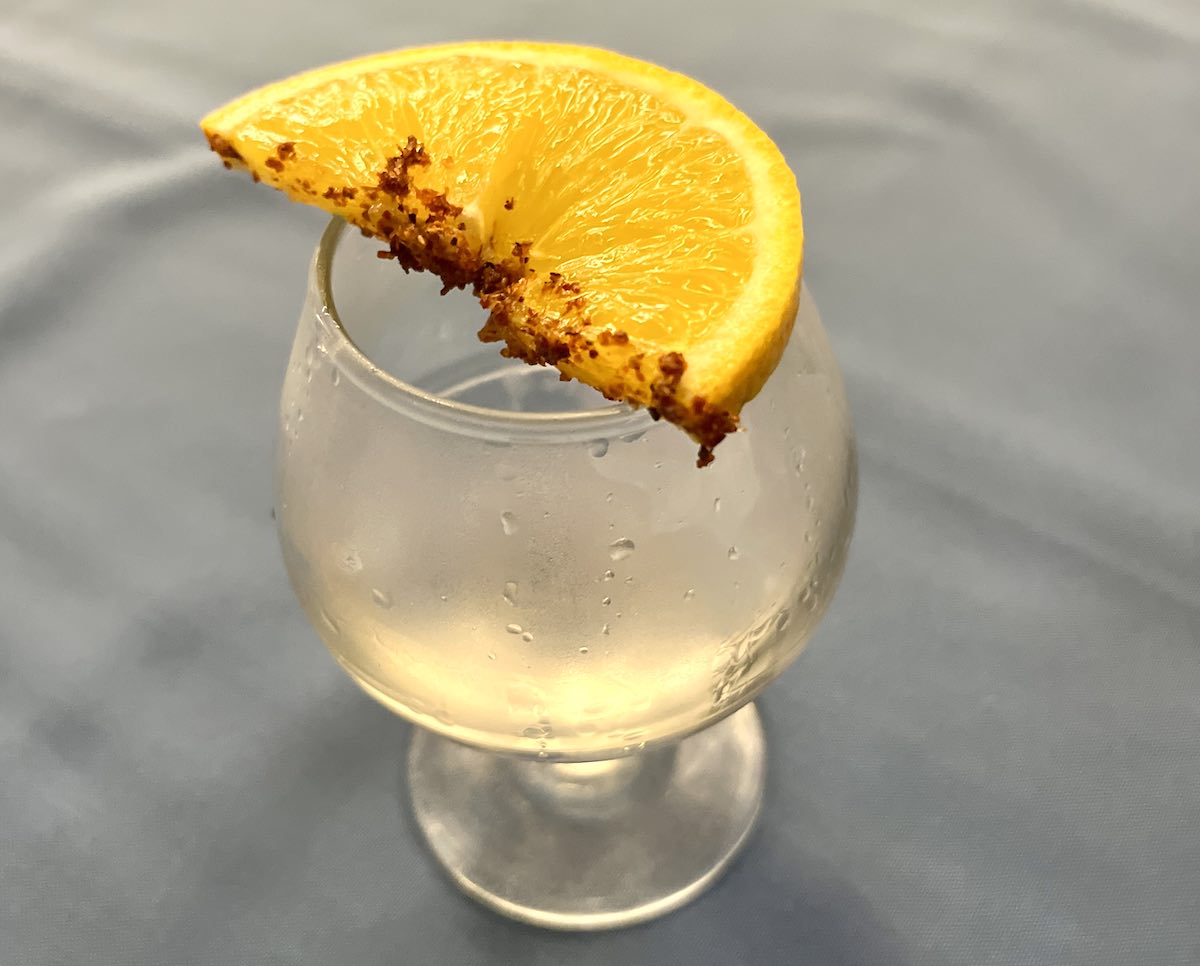 A glass of mezcal a traditional distilled spirit made from the agave plant. 