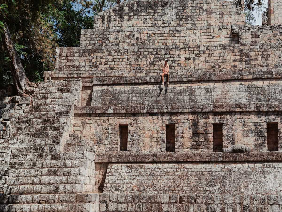 Copan Ruinas with person sitting. 