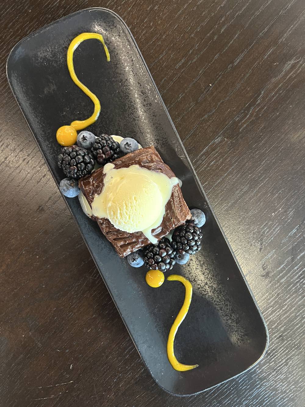 Dramatic dessert of chocolate with fresh berries. 