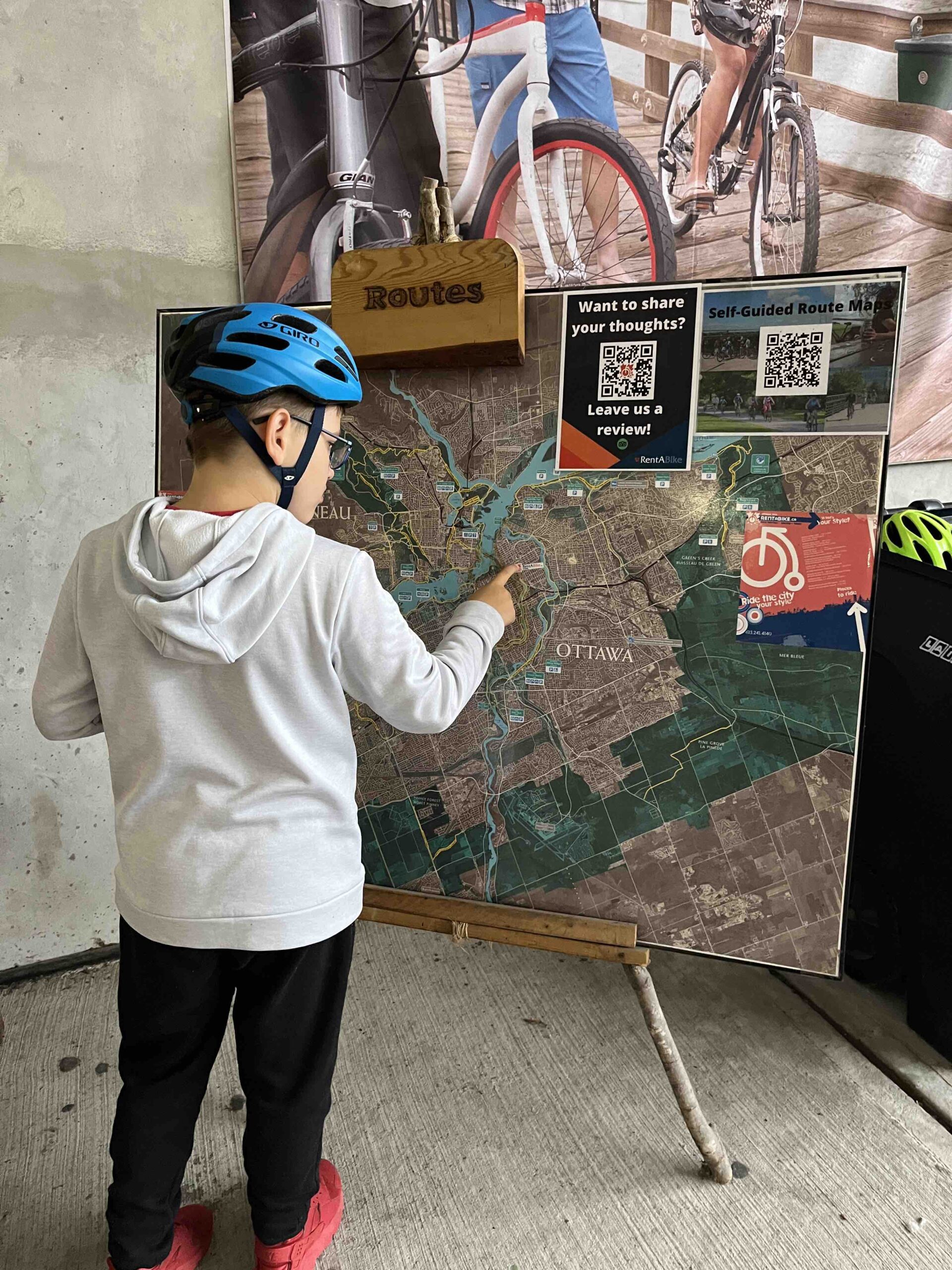 Family looking at a cycling map in Ottawa. 