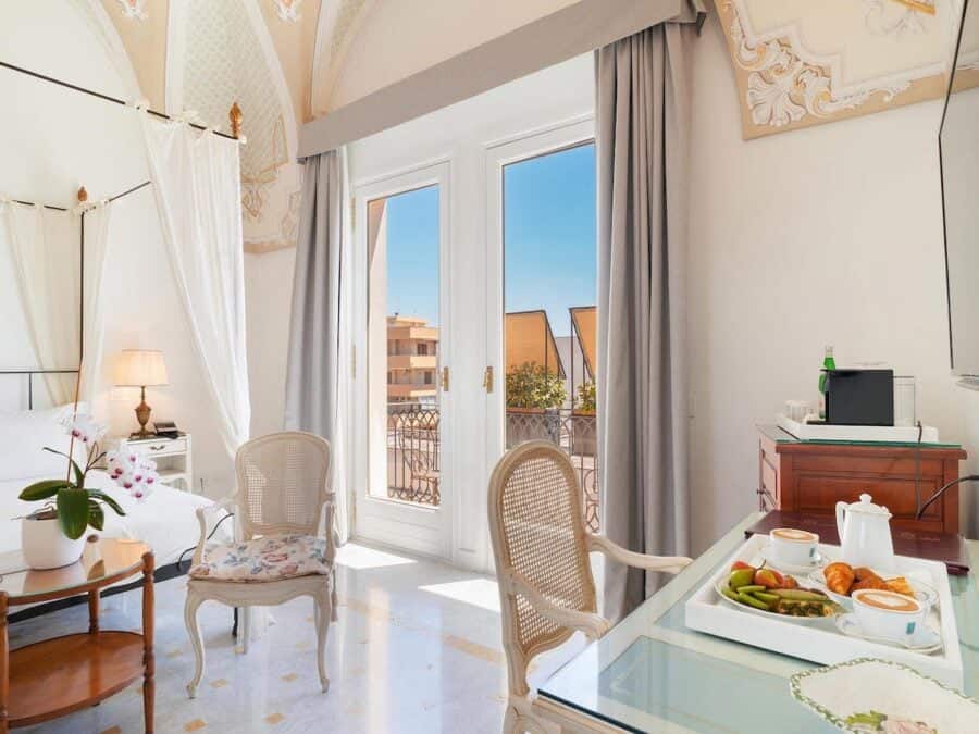 Interior of an elegant guest room at Hotel Palazzo del Corso, a luxury hotel in Gallipoli Italy. (Credit: Palace and Palace Luxury Hotels)