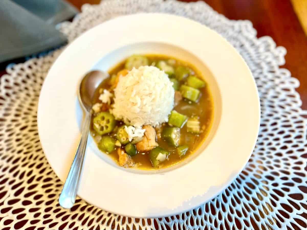 Gumbo in bowl with spoon. 