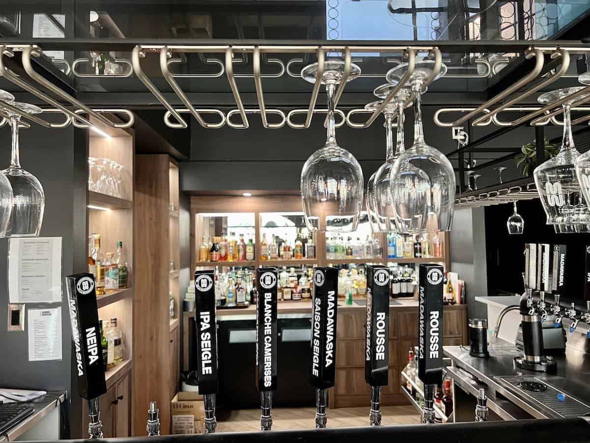 Beer taps inside of a microbrewery.