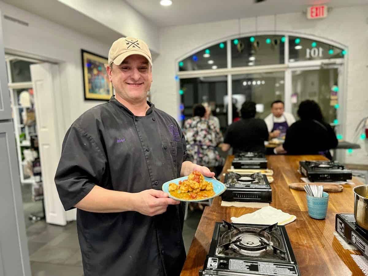 Chef Mark Falgoust with Shrimp Étoufée in hand.