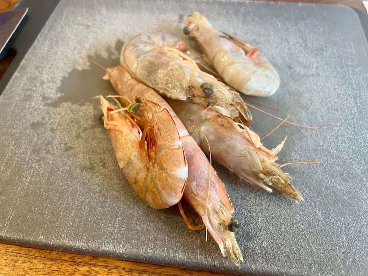 Shrimp for Shrimp Étoufée on cutting board.