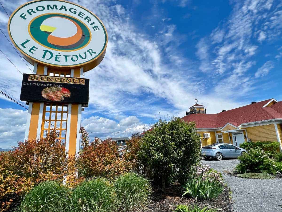 Exterior on Cheese Factory with sign.