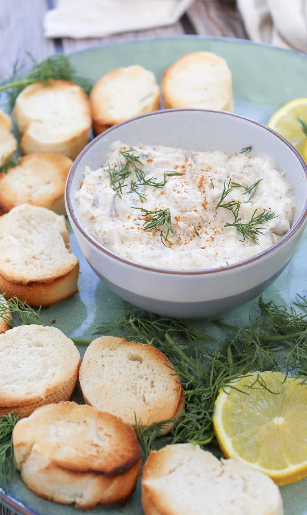 Close-up of a fish dip with crostini.