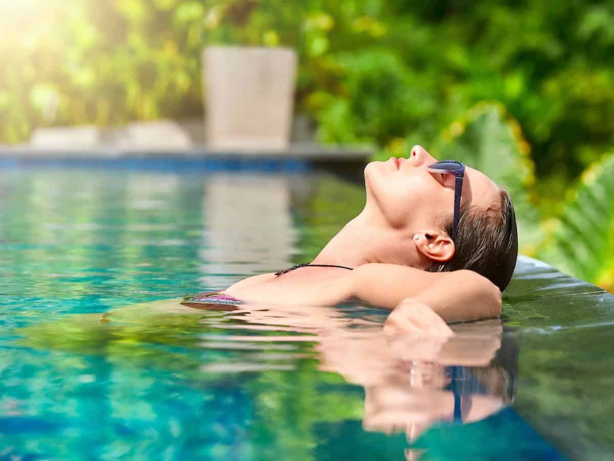 Relax in a swimming pool.