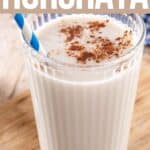 A glass of horchata with Pinterest title.