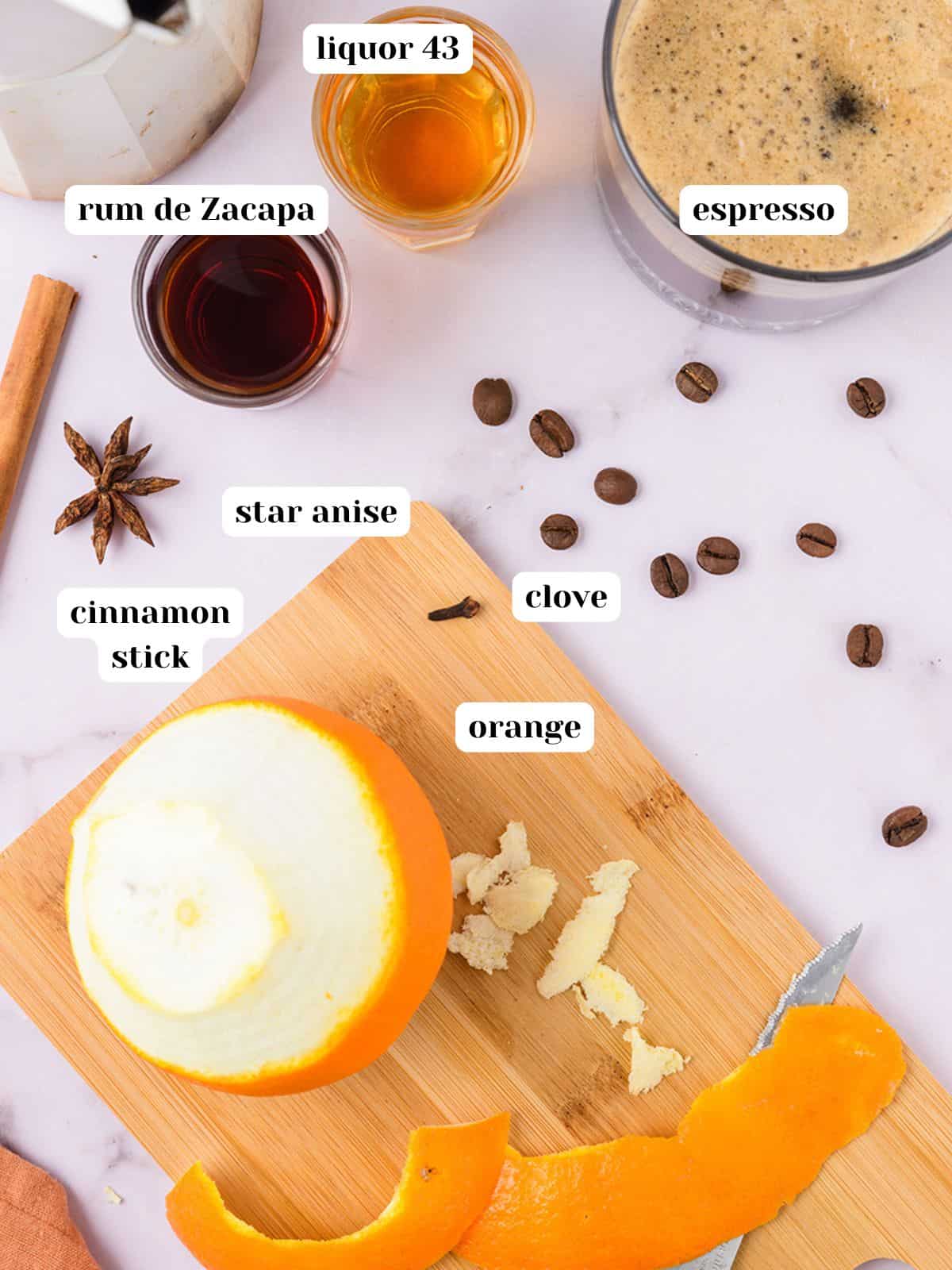 Ingredients to make a Christmas carajillo cocktail on the counter with text labels.