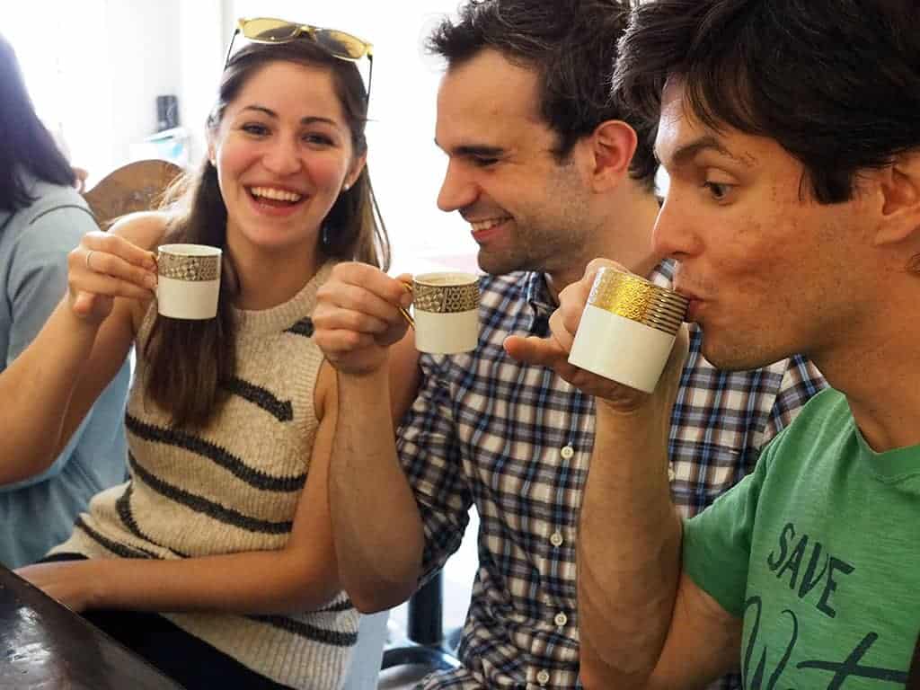 People enjoying coffee in Kensington Market. 
