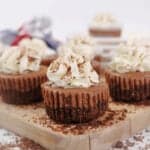 Feature shot of Chocolate Kahlua Mini Cheesecakes on a wooden board.